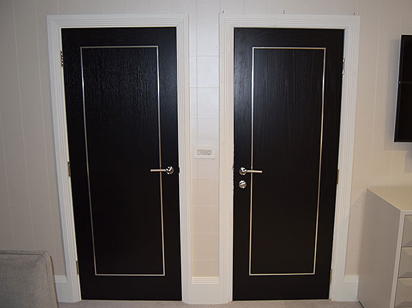 black oak door chrome inlays decorative steel